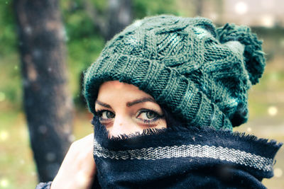 Close-up portrait of woman wearing hat