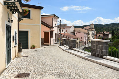 A narrow street between the houses of ruviano, a small village in the province of caserta in italy.