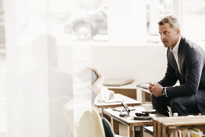 Business people having an informal meeting at a cafe