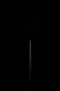 Low angle view of sky over black background