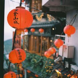 Lanterns hanging by building