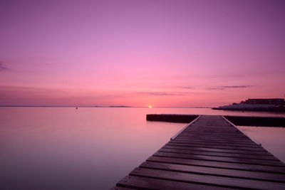 Scenic view of sea against sky at sunset