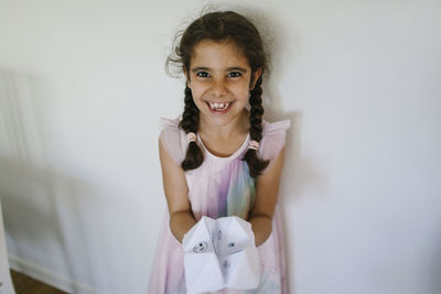 Girl holding paper fortune teller