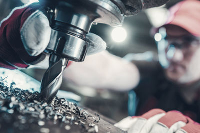 Cropped image of people working in factory