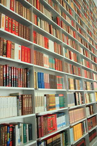 Full frame shot of books arranged on shelf in library