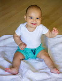 Sweet chubby baby on the floor. baby boy at home