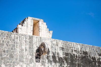 Low angle view of building against blue sky