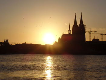 Silhouette of city at sunset