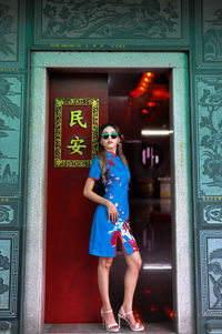 Asian nyonya female portrait in chinese traditional cheongsam, qipao photoshoot chinese new year