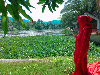 Side view of woman standing on field