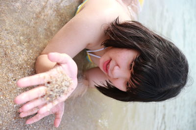 High angle view of young woman in water