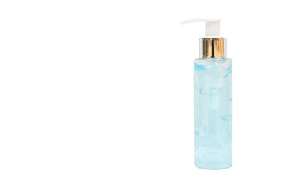 Directly above shot of glass bottle on white background