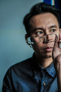 Portrait of young man wearing eyeglasses