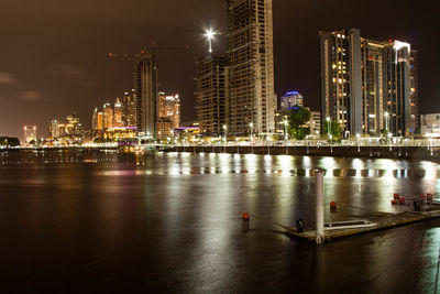 Illuminated buildings in city at night