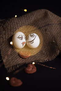 High angle view of illuminated candles on table