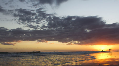View of calm sea at sunset