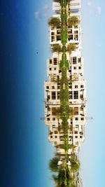 Buildings against blue sky and clouds