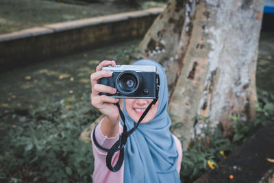 Portrait of boy photographing