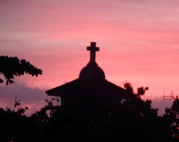 Low angle view of silhouette church against sky