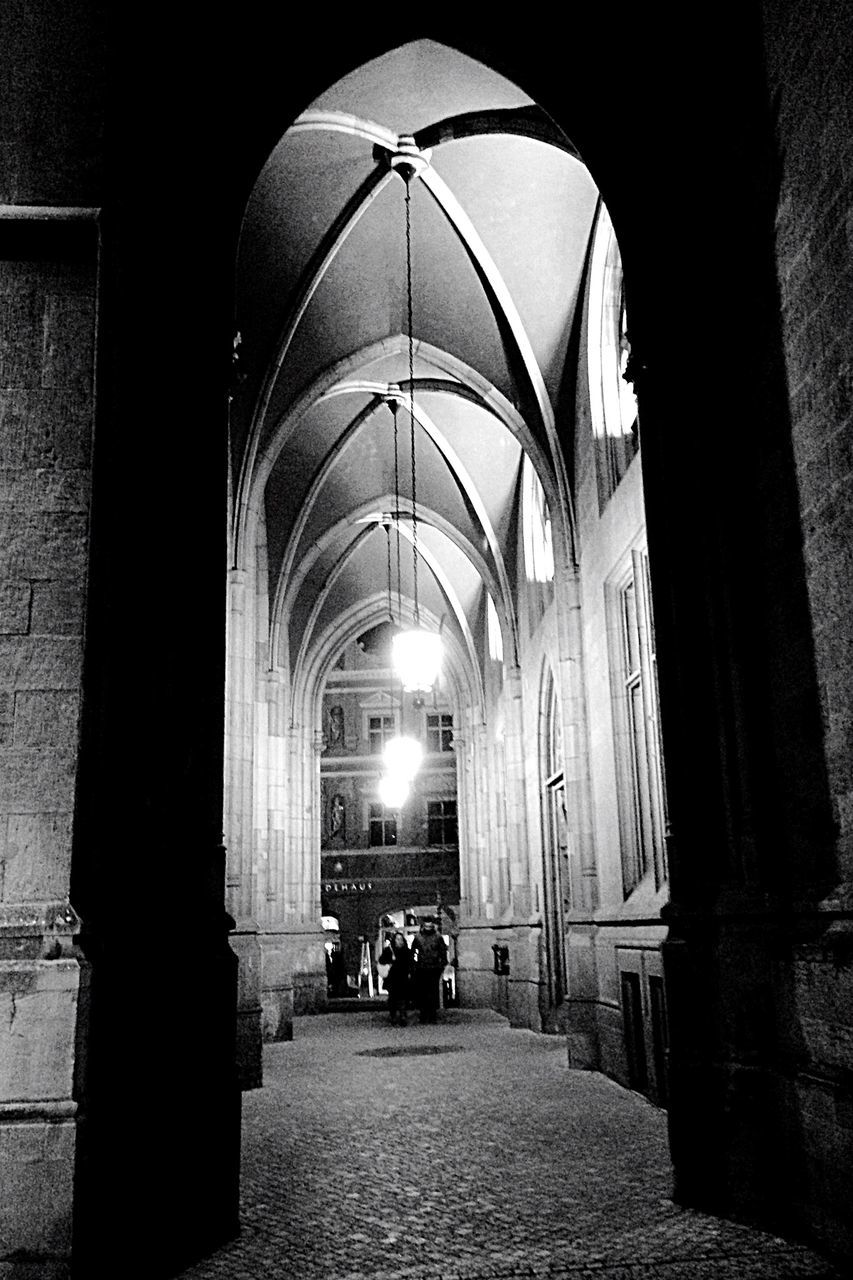 arch, architecture, built structure, indoors, place of worship, the way forward, religion, church, archway, architectural column, spirituality, corridor, building exterior, entrance, illuminated, history, incidental people, arched