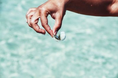 Close-up of hand holding water