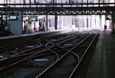 Train at railroad station platform at night
