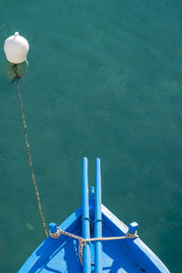 Cropped image of ship against sea