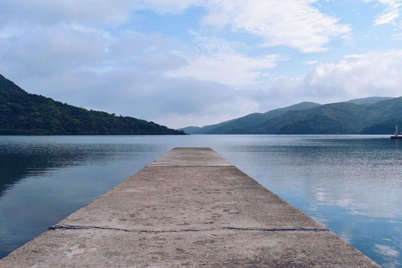 SCENIC VIEW OF LAKE AGAINST MOUNTAINS