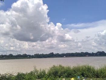 Scenic view of landscape against cloudy sky