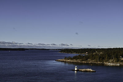 Sailboats in sea against sky