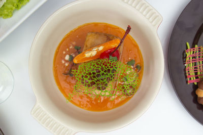 Directly above shot of serving soup in bowl