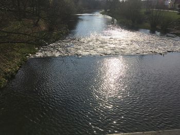 High angle view of river flowing in forest