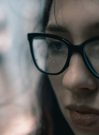 Close-up of young woman wearing eyeglasses