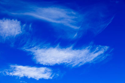 Low angle view of vapor trail in blue sky