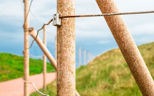 Barbed wire fence on field