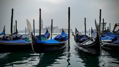 Boats moored in water