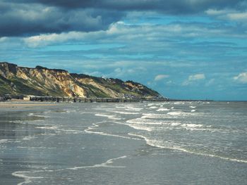 Scenic view of beach against sky