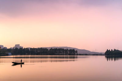 Scenic view of lake against sky during sunset