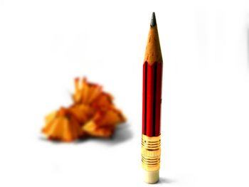 Close-up of pencils against white background