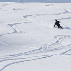 Man skiing in snow covered mountain