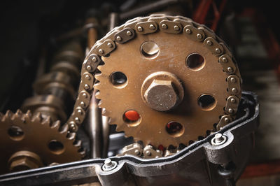 Close-up of a camshaft gear on a sixteen valve engine in a car workshop