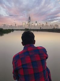 Rear view of man looking at river