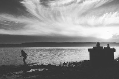 Scenic view of sea against sky at sunset