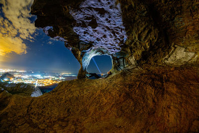 Scenic view of cave against sky