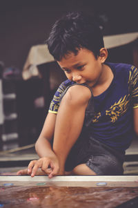 Boy looking at camera at home