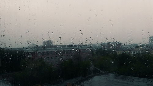 Full frame shot of wet window in rainy season