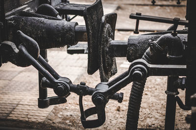 Close-up of metal chain against fence