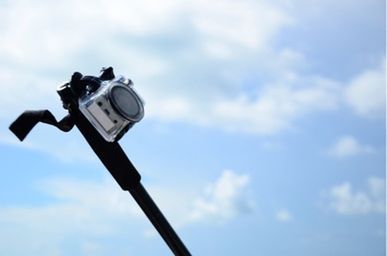 Low angle view of street light against cloudy sky