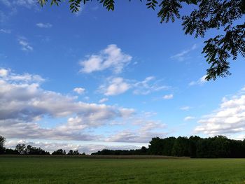 Countryside landscape against blue sky