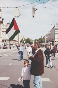 Woman standing on city street